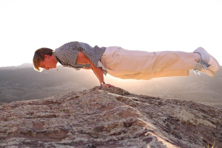 Band Member Balancing on Rocks Photoshoot Web